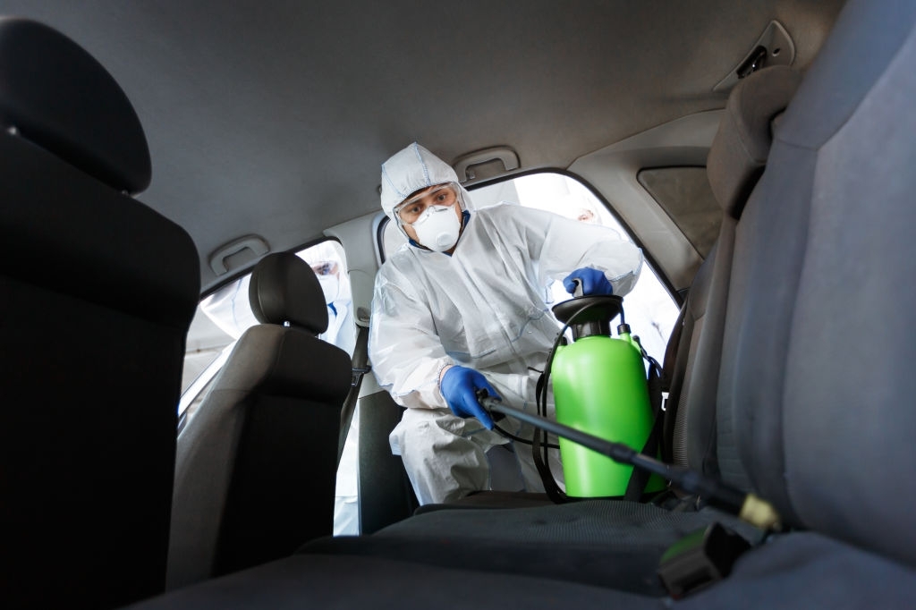 disinfecting with chemicals his car from coronavirus,